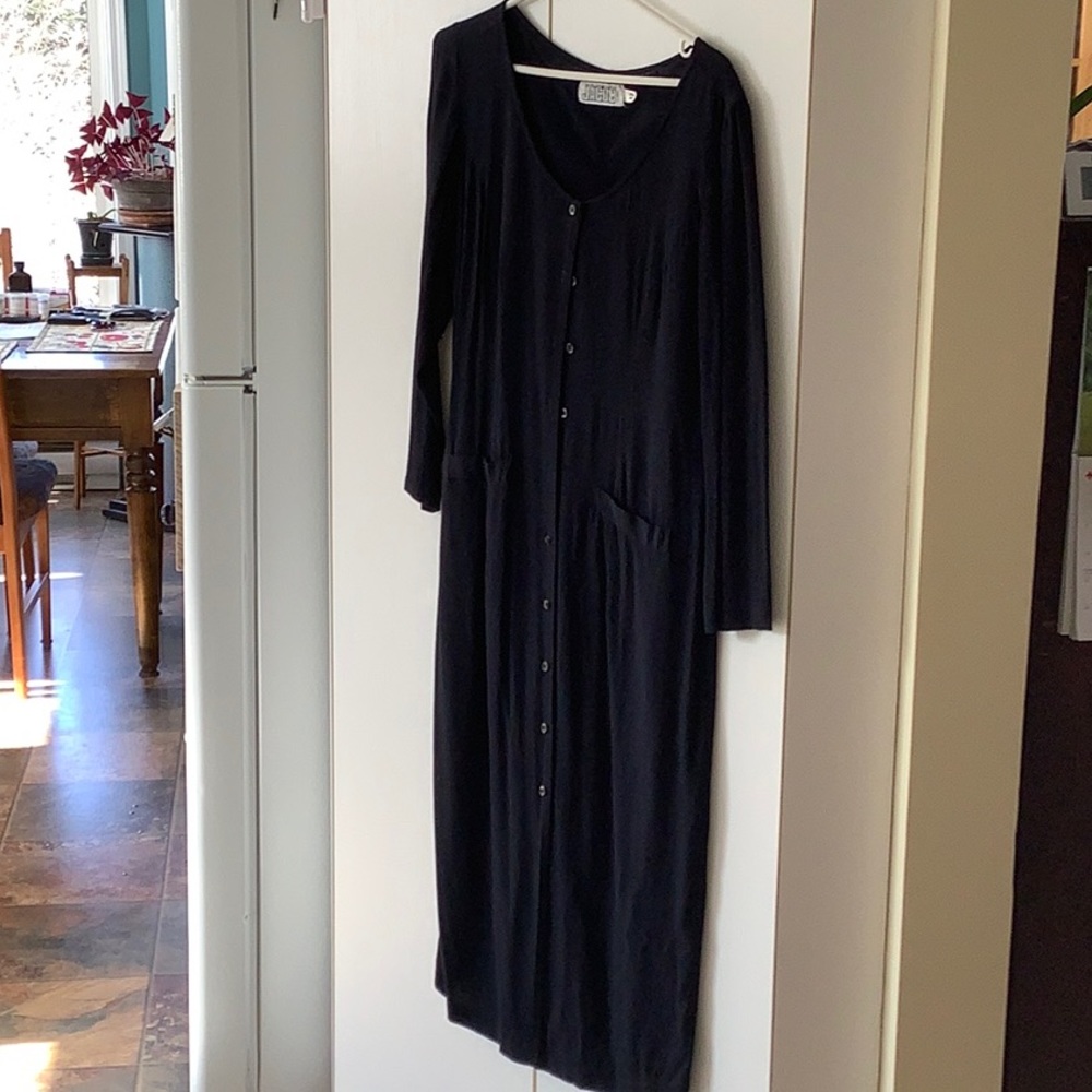 Long sleeved dress, buttons down the front.